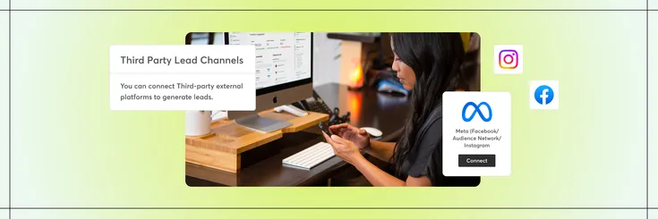 Woman sitting at desk with phone on her hand and a computer showing lead management software