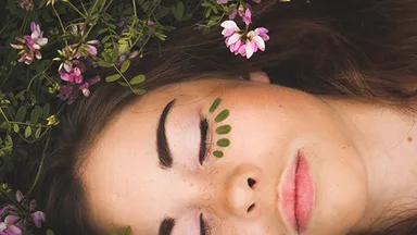 girl relaxing in flowers