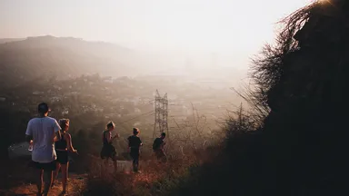 Five hikers in LA on going down a steep trail