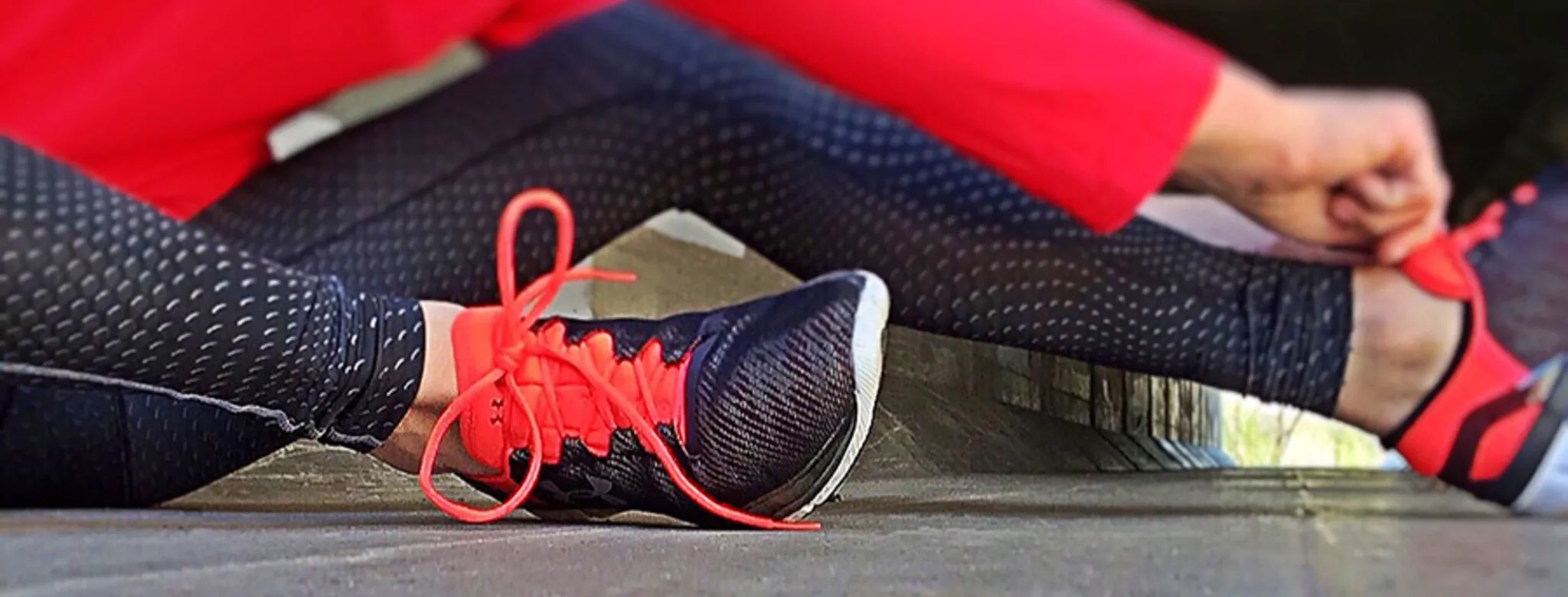 Woman tying running shoes