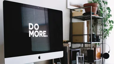 computer on desk with do more