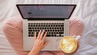 woman on laptop with latte