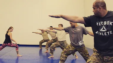 Military members practicing yoga